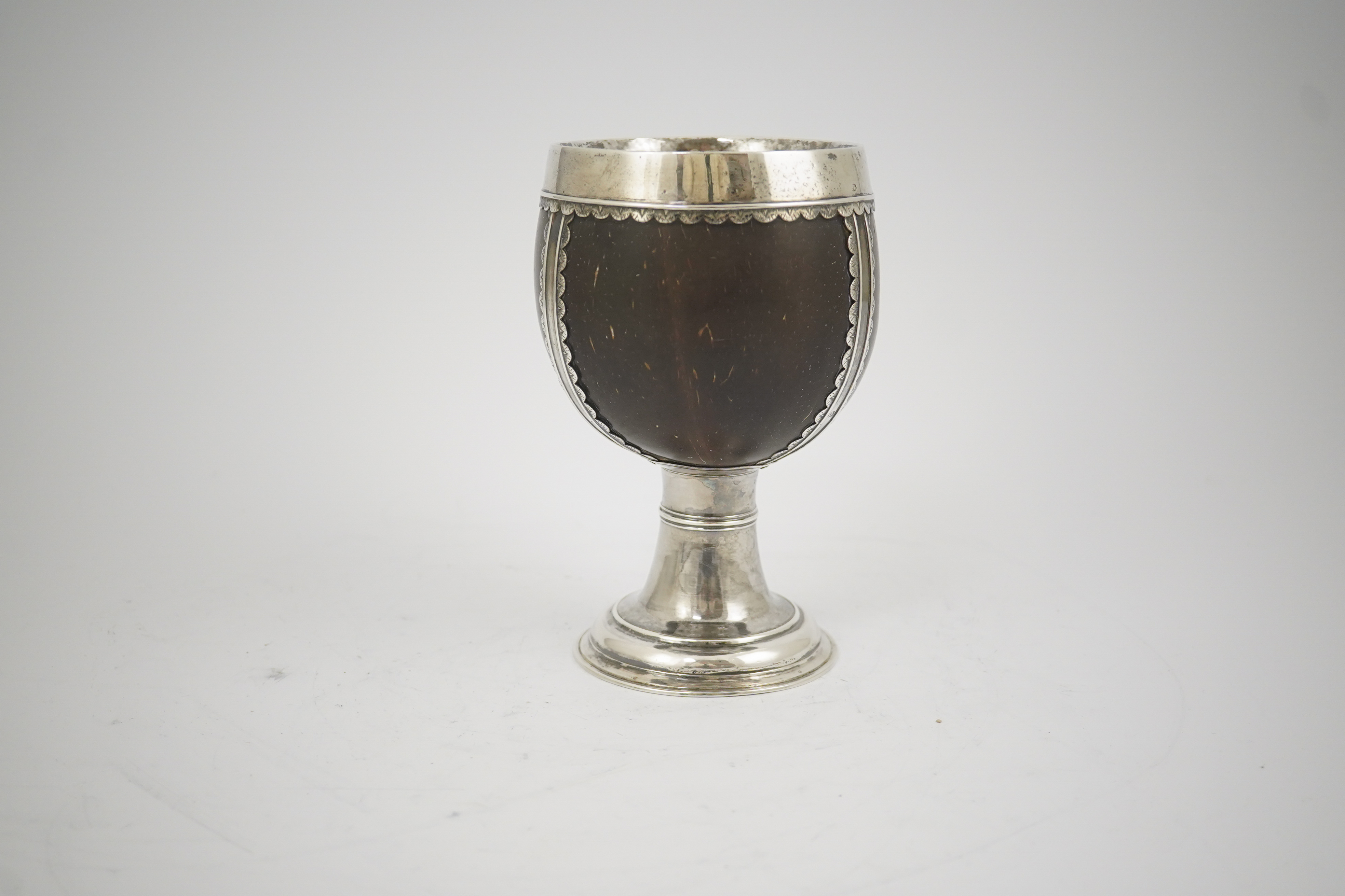 A late George I? silver mounted coconut cup, makers mark only, possible Samuel Eaton, London